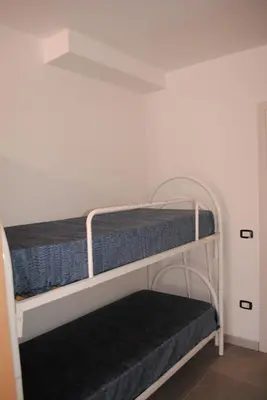 Letto o letti in una camera di Summer Beach Rooms