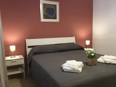 Letto o letti in una camera di Appartamenti Rimembranze