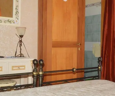 Letto o letti in una camera di B&B TascaPachino