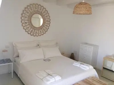 Letto o letti in una camera di Casa Memi