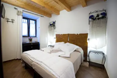 Letto o letti in una camera di Le Case Dello Zodiaco albergo diffuso