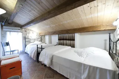 Letto o letti in una camera di Le Case Dello Zodiaco albergo diffuso