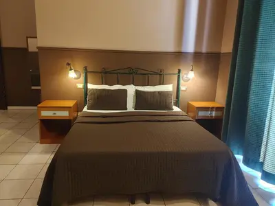 Letto o letti in una camera di Hotel Biscari
