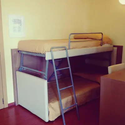 Letto o letti in una camera di Hotel Paclà