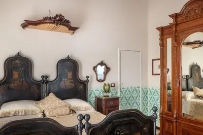 Letto o letti in una camera di Villa Nicolaci - Liberty Suites