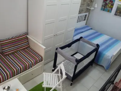Letto o letti in una camera di Ortigia Vista Cielo e Mare - ortigiavistamareonweb it