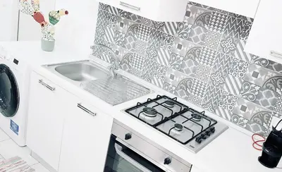 Cucina o angolo cottura di Ortigia Vista Cielo e Mare - ortigiavistamareonweb it