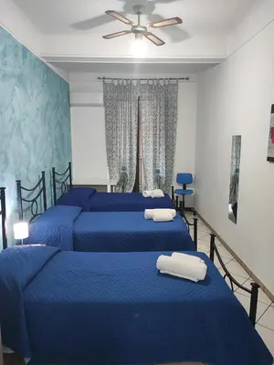 Letto o letti in una camera di Casa Desirè