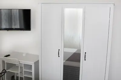 TV o dispositivi per l'intrattenimento presso Aeroporto Bellini Rooms