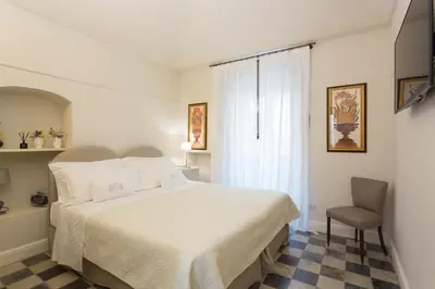 Letto o letti in una camera di San Carlo Suites