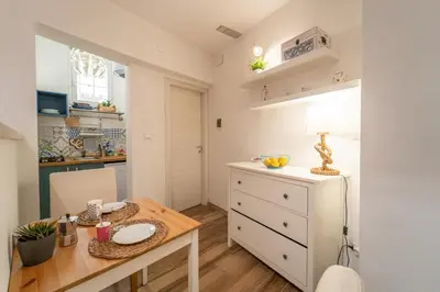 Cucina o angolo cottura di GuestHost - Casa Borbonica Cozy Apartment in Ortigia GROUND FLOOR