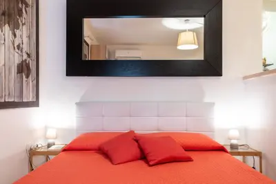Letto o letti in una camera di GuestHost - Casa Borbonica Cozy Apartment in Ortigia GROUND FLOOR