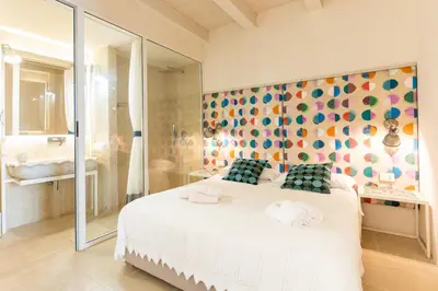 Letto o letti in una camera di Blue Levante Vista Mare con terrazza