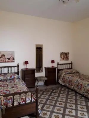 Letto o letti in una camera di Casa Nonna Rosa