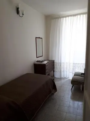 Letto o letti in una camera di Casa Nonna Rosa