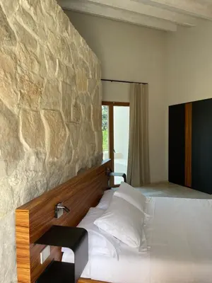 Letto o letti in una camera di Chiusa Di Carlo Agriturismo