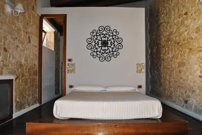 Letto o letti in una camera di Chiusa Di Carlo Agriturismo