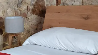 Letto o letti in una camera di Chiusa Di Carlo Agriturismo