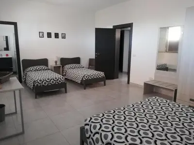 Letto o letti in una camera di Villa dei Gigli Rossi