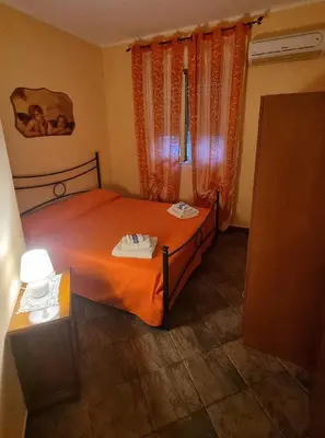 Letto o letti in una camera di Villa Sally