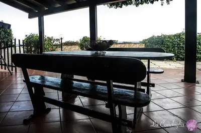 Balcone o terrazza di Casa la conchiglia sulla spiaggia