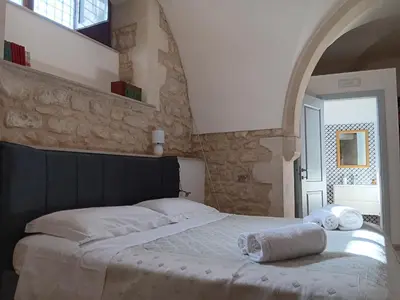 Letto o letti in una camera di Casa Sipione Papa