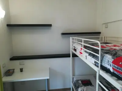 Letto o letti a castello in una camera di Augusta Isola Appartamento in Pieno Centro