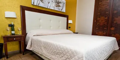 Letto o letti in una camera di Hotel Flora