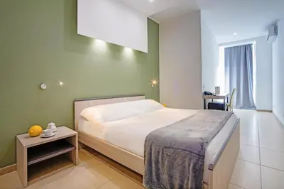 Letto o letti in una camera di San Giorgio Palace Hotel Ragusa Ibla