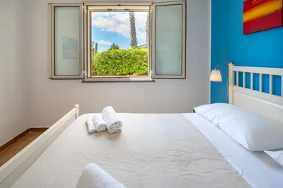 Letto o letti in una camera di Villa Carmela Arenella