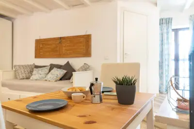 Area soggiorno di GuestHost - Casa Talete Cozy Apartment in Ortigia - FIRST FLOOR