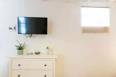 TV o dispositivi per l'intrattenimento presso GuestHost - Casa Talete Cozy Apartment in Ortigia - FIRST FLOOR