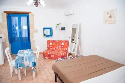 Letto o letti in una camera di Xenia - Il Vicoletto delle Dee