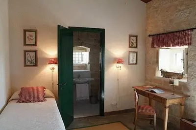 Letto o letti in una camera di Masseria Cianciò