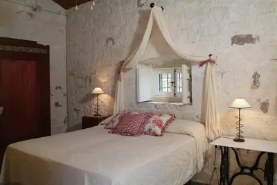 Letto o letti in una camera di Masseria Cianciò