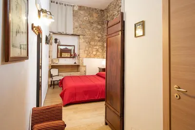 Letto o letti in una camera di Nonna Iole