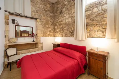 Letto o letti in una camera di Nonna Iole