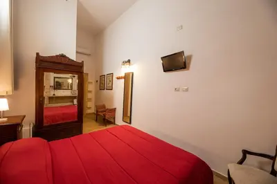 Letto o letti in una camera di Nonna Iole