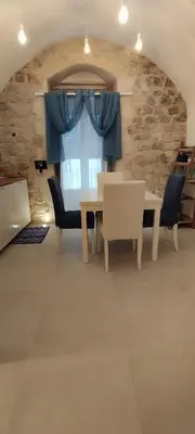 Area soggiorno di Itinerario Barocco Apartment Ragusa Ibla - Eleganza e Comfort nel Cuore del Barocco Siciliano