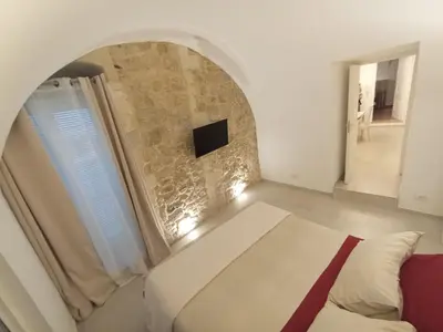 Letto o letti in una camera di Itinerario Barocco Apartment Ragusa Ibla - Eleganza e Comfort nel Cuore del Barocco Siciliano