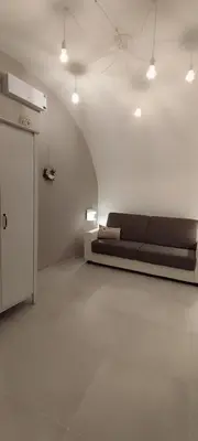 Area soggiorno di Itinerario Barocco Apartment Ragusa Ibla - Eleganza e Comfort nel Cuore del Barocco Siciliano