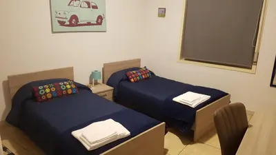Letto o letti in una camera di Etna Parking
