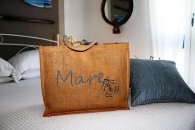 Letto o letti in una camera di B&B Casa del Faro SanVallero Adults Only