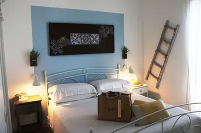 Letto o letti in una camera di B&B Casa del Faro SanVallero Adults Only