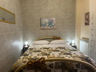 Letto o letti in una camera di Domus Archimede