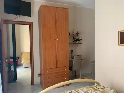 Letto o letti in una camera di Domus Archimede
