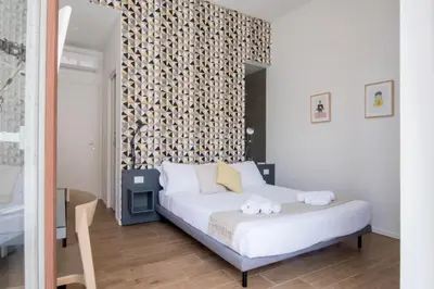 Letto o letti in una camera di Casa Qosi B&B