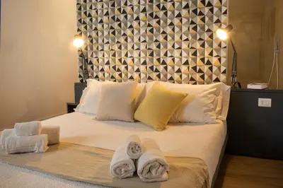 Letto o letti in una camera di Casa Qosi B&B