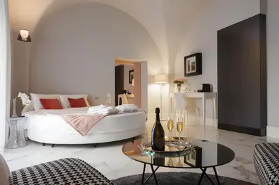 Letto o letti in una camera di Quattro Canti Suites