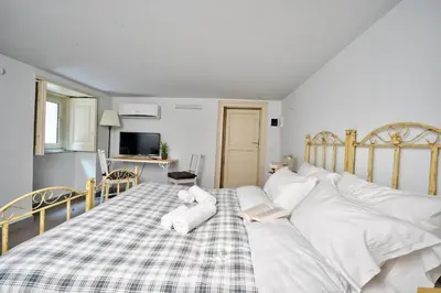 Letto o letti in una camera di Lettera Living